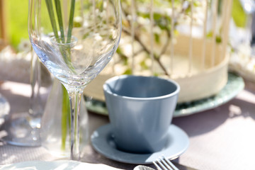 Empty glass on blurred table setting background