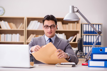 Businessman receiving letter in the office