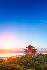 Fototapeta premium Beautiful Hangzhou West Lake and ancient pavilion architectural scenery at sunset