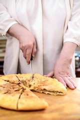 Cut a piece of apple pie closeup