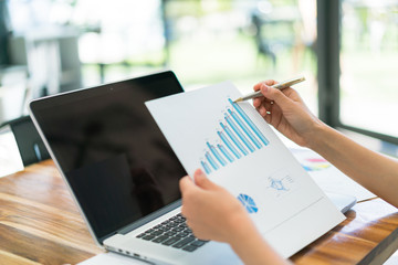 Business people using laptop and Financial charts at meeting office   .