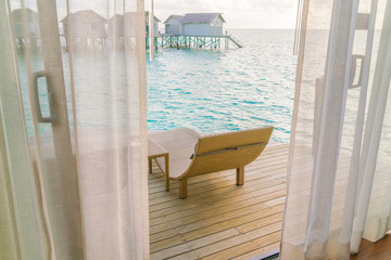 Beautiful tropical Maldives resort hotel with beach and blue water .