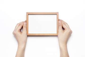 woman hand hold a photo frame isolated white.