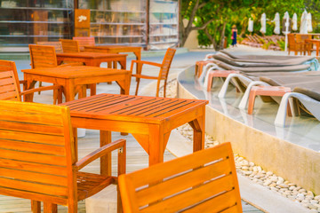 Table and chairs at restaurant in tropical Maldives island .