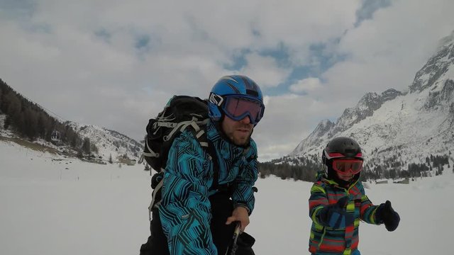 Little boy skiing in the Alps.
Son when skiing. They learn to ski with their parents. Boy with his father. Selfie.
