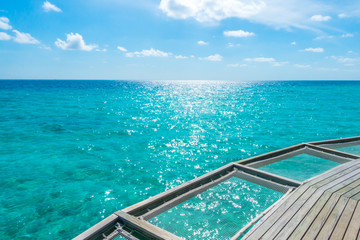 Fototapeta na wymiar Vacation net seat in tropical Maldives island and beauty of the sea with the coral reefs .
