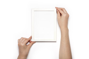 woman hand hold a white photo frame isolated white.