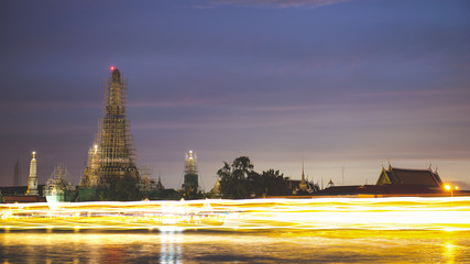 Wat Arun with the boat light - Bangkok, Thailand.