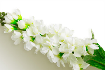 Naklejka na ściany i meble Artificial flowers on white color background with clipping path and empty space