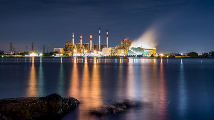 Naklejka premium Power station and river at dusk
