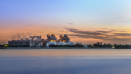 Fototapeta premium Industrail Factory along the river at early morning.