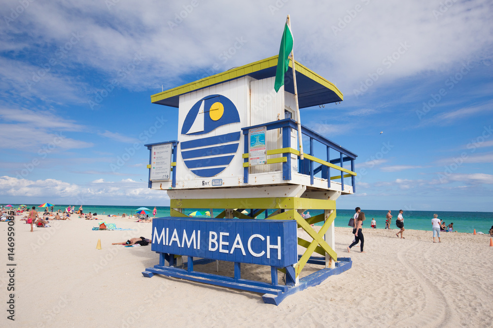 Wall mural usa, florida, miami beach. april, 2017. lifeguard tower in a colorful art deco style, with blue sky 