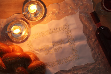 shabbat image. challah bread and candles.