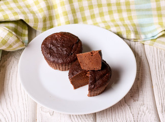 chocolate dark cooked muffin on a white plate