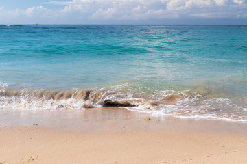 Ocean waves on a tropical beach of magic Bali island, Indonesia.