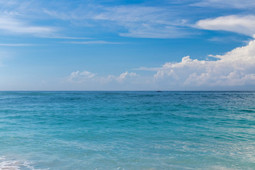 Naklejka na ściany i meble Ocean waves on a tropical beach of magic Bali island, Indonesia.
