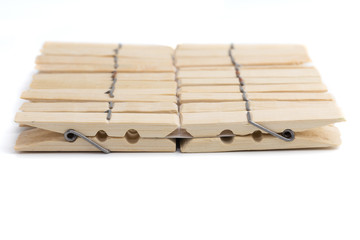 wood clothespegs on white background