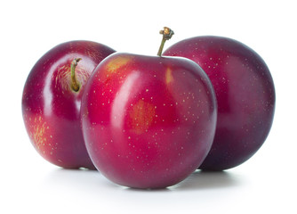 Three plums isolated on white background