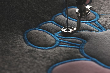 embroidery and application with embroidery machine - progress satin stitch - background and...