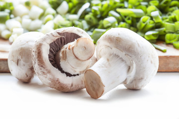 Spring mushrooms champignons close with greens