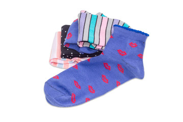 Women's sock against of the stack of other socks