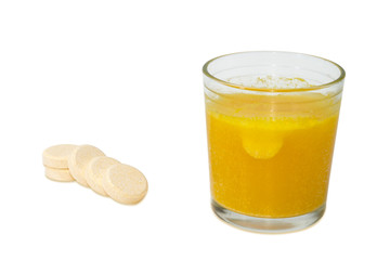 Effervescent medicinal tablet thrown into the glass of water