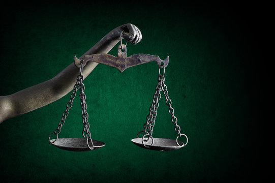 Lady Justice's and holding Scale of Justice isolated on grunge background