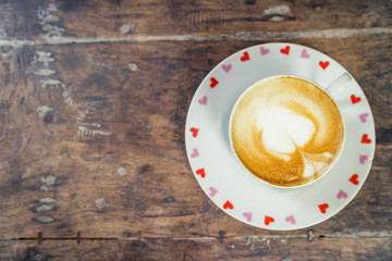Top view latte coffee on wood table with space