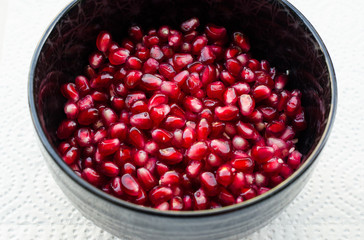 Bowl filled with fresh pomegranate seeds
