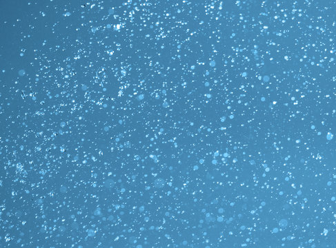 spray water on a blue background