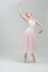 Fototapeta na wymiar Blonde ballerina in studio
