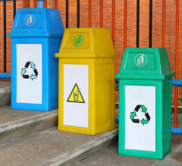 blue yellow and green garbage bin