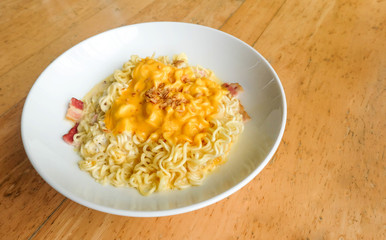 Noodle bacon with cheese on wood background..
