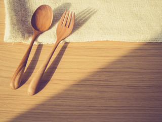 Fork and Spoon on wooden table Background