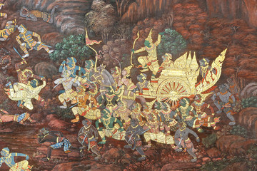 Traditional Thai painting art about Ramayana story on display at the temple wall Wat Prakaew in Bangkok, Thailand.