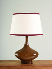 Fototapeta premium Elegant brown bulbous vintage lamp with shade