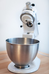 Kitchen appliances - planetary mixer matt light pearl color, on a white background