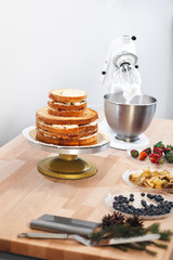 Ingredients for making a cake on a table on a white background