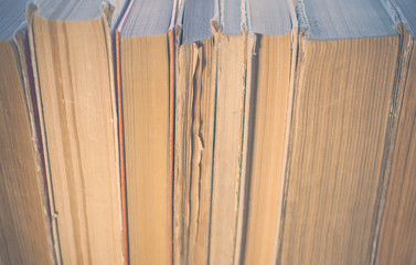Texture pile of old books. Vintage toning.