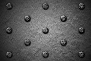 grunge metal background. rivet on metal plate.