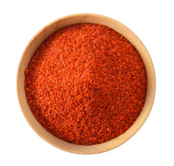 Cayenne pepper in wood bowl on white background