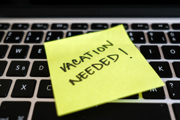 Vacation needed. Break, burnout, office stress message on laptop. 