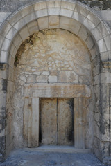 Fototapeta na wymiar Entrance to the cave tombs in the ruins of the Old City Beit She'arim, Israel
