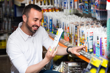 man picking sealing component