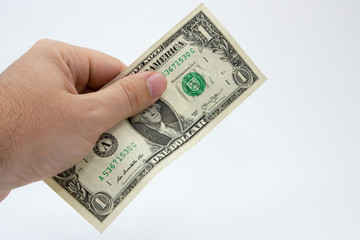 A close up photo of a Caucasian male hand holding a 1 dollar USA note 
