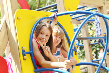 Fototapeta na wymiar Portrait of childrens having fun on the playground