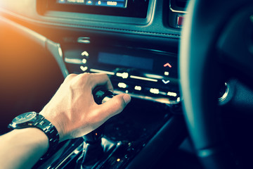 close up of hand manual gear shift knob for car industrial concept