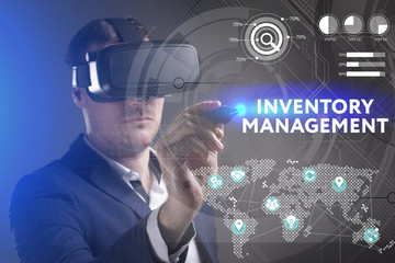 Business, Technology, Internet and network concept. Young businessman working in virtual reality glasses sees the inscription: Inventory management