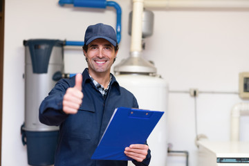 Smiling plumber at work