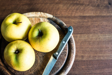 green apples on a chopping board